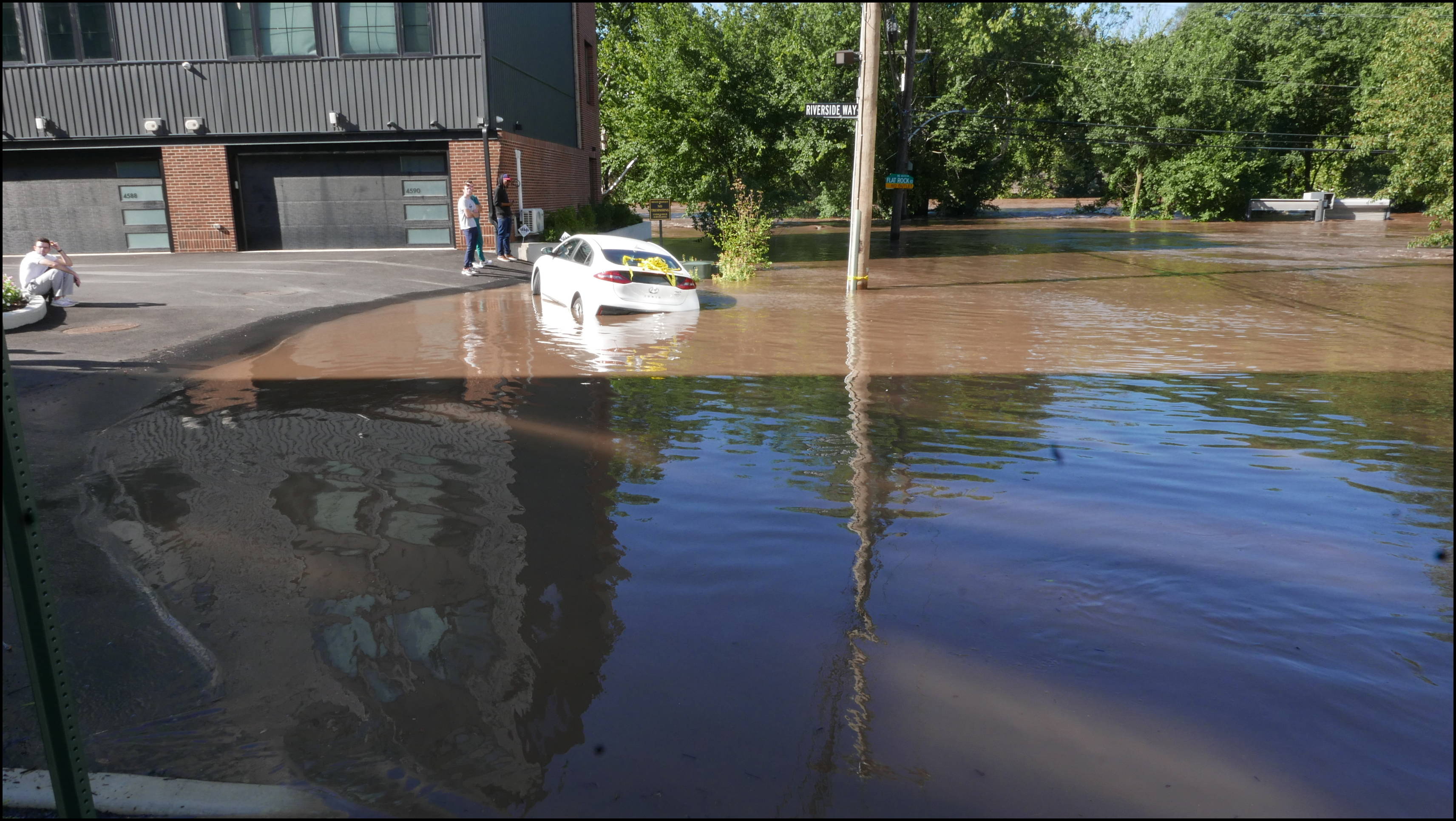 The Locks development -- Flooded car blocking the entrance.