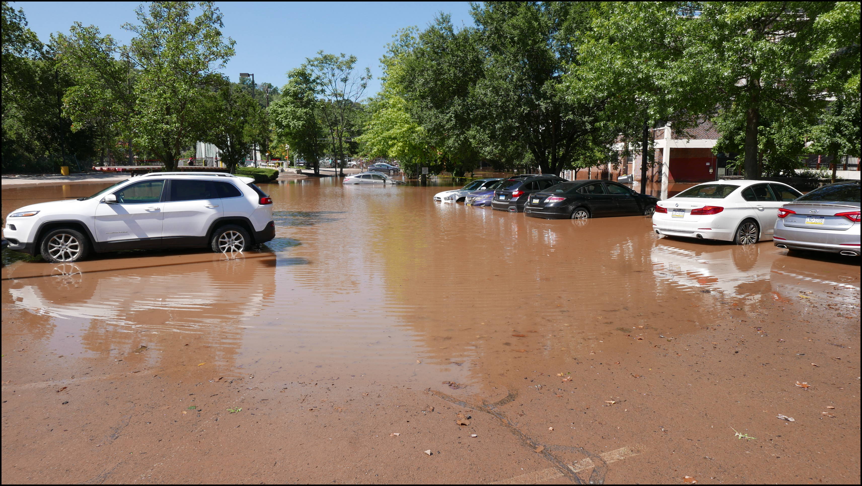Southern limit of flooding on Main Street -- Flooded cars in the theater parking lot.