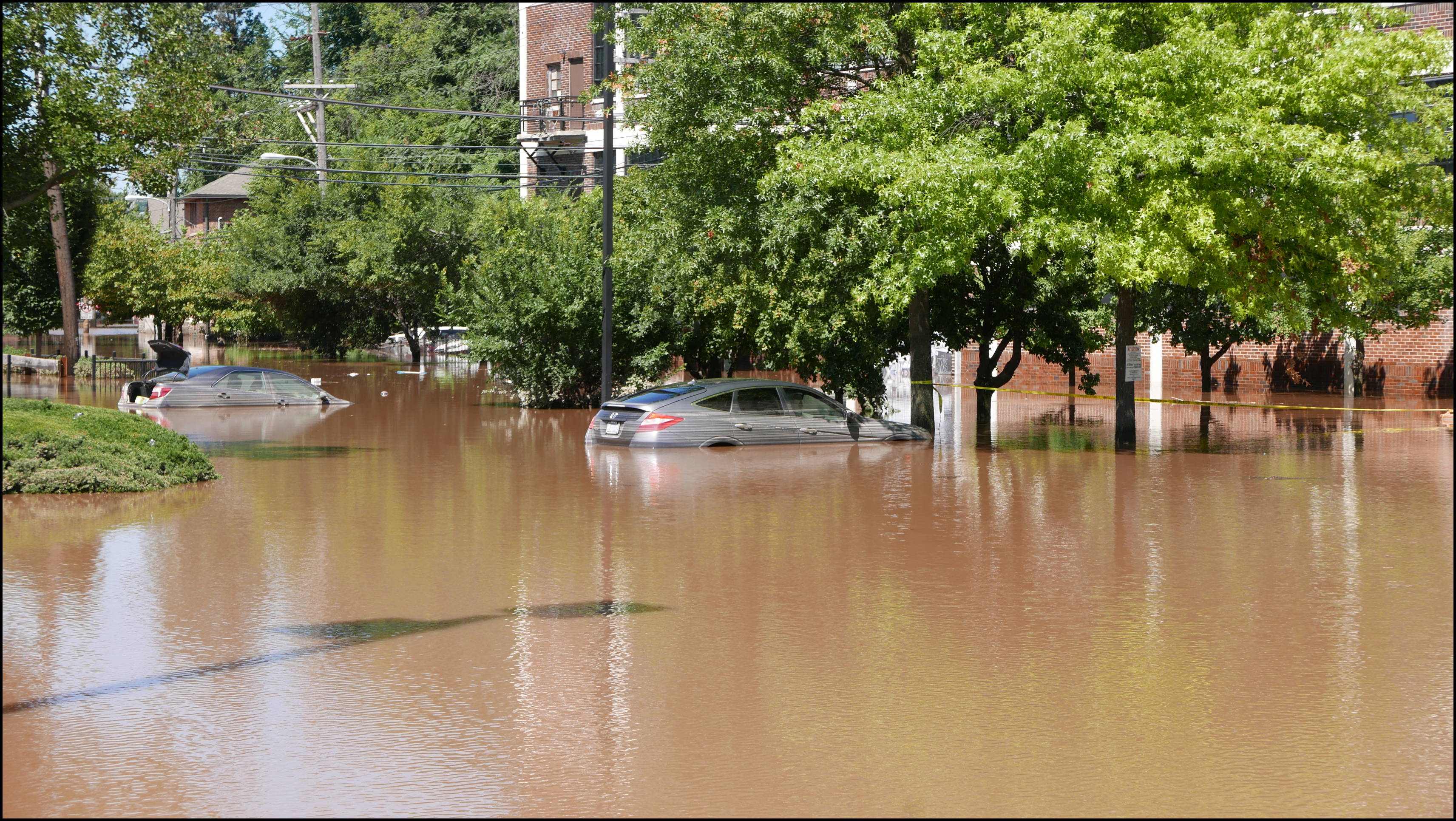 Southern limit of flooding on Main Street -- Flooded cars in the theater parking lot.