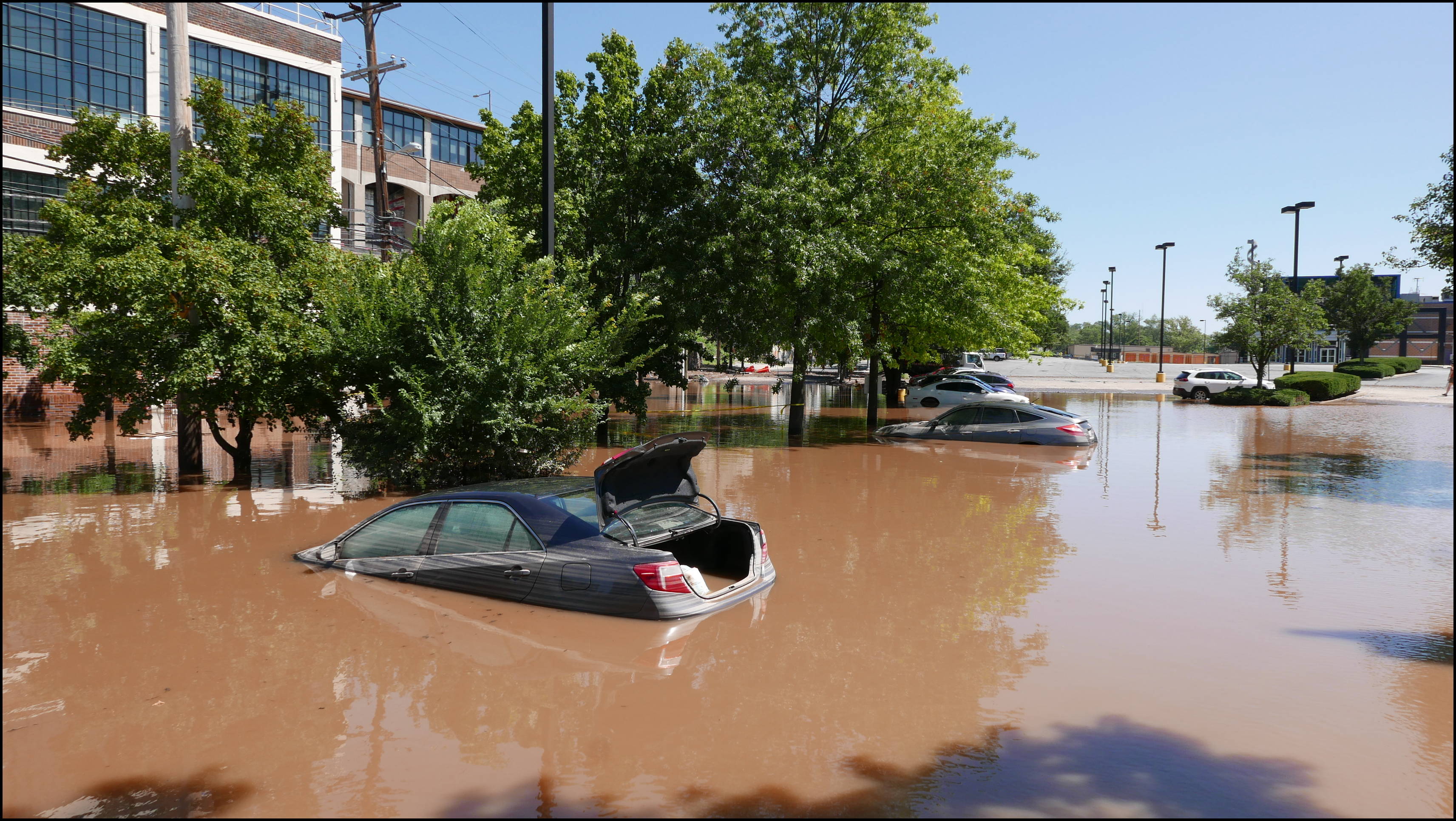 Southern limit of flooding on Main Street -- Flooded cars in the theater parking lot
