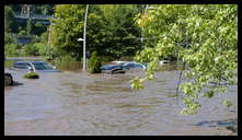 Cotton Street and the canal -- Flooded cars in the Rec Center parking lot