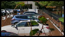 Southern limit of flooding on Main Street -- Flooded cars in the Bridge Five parking lot.