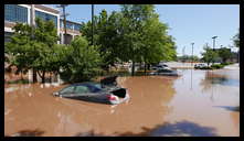 Southern limit of flooding on Main Street -- Flooded cars in the theater parking lot
